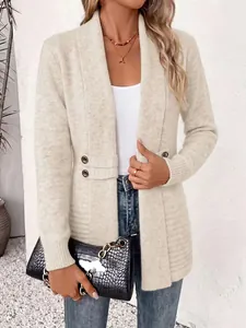 Detail view of a stylish beige longline cardigan featuring double-breasted buttons and knit texture