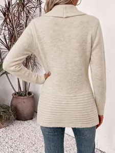 Back view of elegant cream knit cardigan featuring a ribbed hem and soft texture