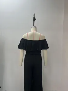 Detailed back view of black off-the-shoulder ruffled top with smocked waist and wide-leg pants set