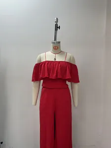 Red off-shoulder ruffled smocked top and wide-leg trousers set displayed on mannequin