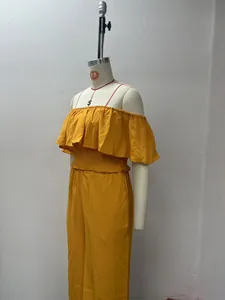 Side view of yellow off-the-shoulder ruffle top and wide-leg trousers set for summer