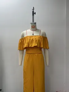 Full view of yellow off-shoulder top and wide-leg trousers on a display mannequin