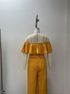 Detailed back view of a yellow ruffle off-shoulder top and wide-leg trousers set.