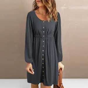 Detail of a dark grey button-down dress featuring an elastic waist and soft fabric