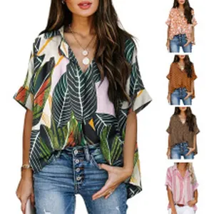 Detailed view of women's V-neck loose tropical leaf print shirt with multiple color variants