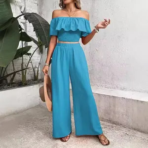 Two-piece solid blue off-shoulder ruffle smocked top and wide-leg pants set for women