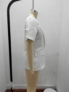 Side view of white short-sleeved loose blazer on mannequin for summer fashion.