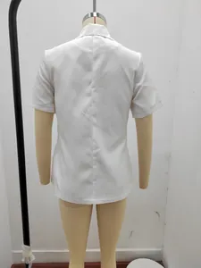 Detailed back view of a white short-sleeved summer blazer displayed on a beige mannequin