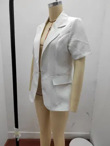 Side view detail of a white short-sleeved blazer jacket on a clothing mannequin