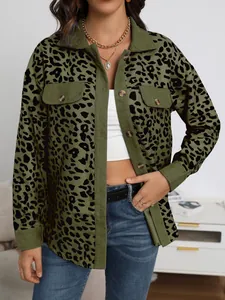 Detailed macro view of green corduroy jacket with leopard print and front pockets.