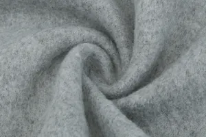 Macrodetail van grijze wollen stof van hoge kwaliteit met zachte pluizige textuur