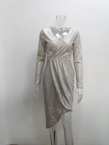 Detailed view of elegant silver glitter V-neck long sleeve cocktail dress on a mannequin