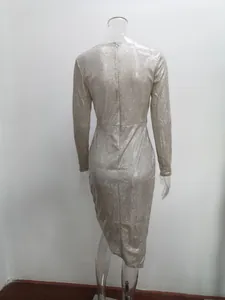 Detailed back view of elegant silver glitter long sleeve evening dress with irregular hem