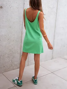Back view of a green waffle knit sleeveless mini tank dress with a deep U-neckline