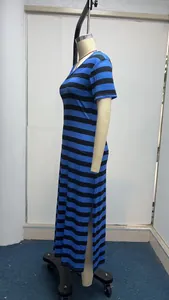 Side view detail of a blue and black striped short sleeve maxi dress with side slit