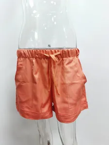 Casual summer peach high-waisted drawstring shorts for women with pockets detail