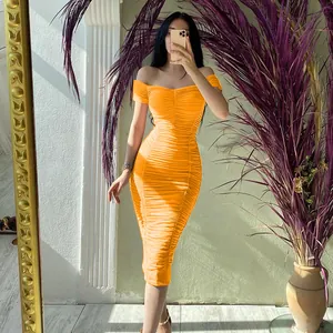 Detail showing the elegant orange ruched off-the-shoulder midi dress texture
