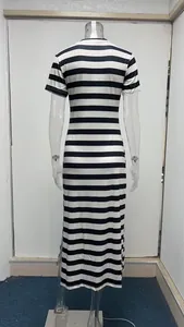 Back view of a classic black and white horizontal striped maxi dress with a side slit.
