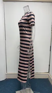 Side view of a pink and black striped maxi dress with side slits and V-neck