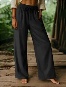 Detail view of black cotton linen wide-leg pants with elastic drawstring waist