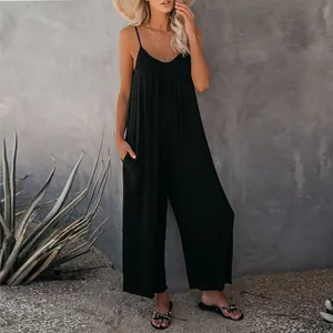 Tuta nera da donna con spalline sottili, tasche e gamba larga per l'estate casual