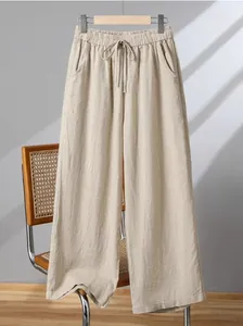 Full view of casual cotton linen wide-leg pants on a hanger against a neutral background