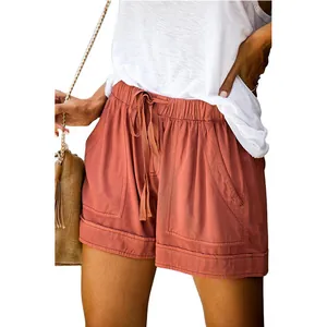 Detail view of women's brick red high-waist casual shorts with functional drawstring