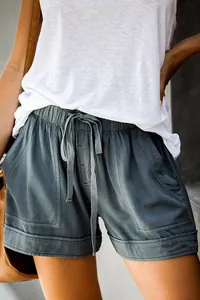 Detail view of women's casual high-waist tencel shorts with drawstring and large pockets