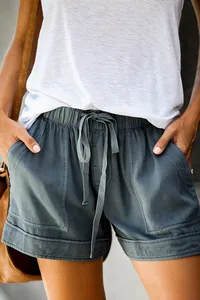 Close-up of high-waist casual shorts with drawstring and large front pockets