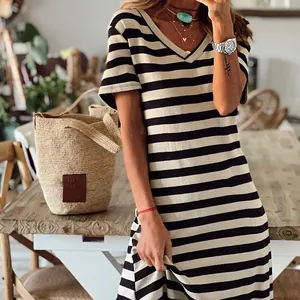 Close-up view of a stylish black and white striped V-neck loose summer dress for women