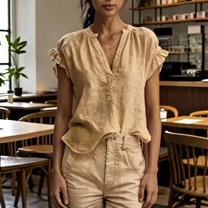 Bohemian beige cotton linen V-neck short sleeve blouse for women in casual café setting