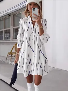 Elegant white long sleeve shirt dress with stylish black wave and polka dot print