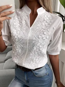 Elegant white V-neck stand collar blouse featuring delicate floral lace embroidery details