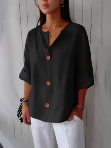 Losse zwarte katoenen linnen blouse met V-hals en bruine knopen voor dames mode