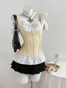 Detailed view of stylish patchwork T-shirt with yellow corset and white ruffles.