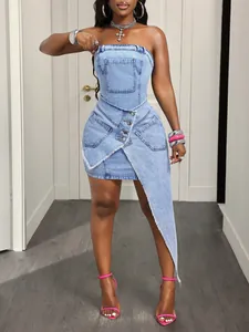 Fashionable light blue asymmetrical denim tube dress featuring raw edges and pocket detail
