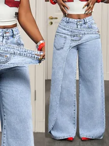 Detail view of trendy light blue wide-leg denim jeans with asymmetric overlap waist design