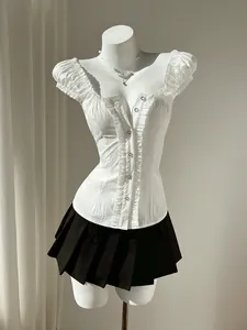 Detailed view of white bubble sleeve shirt with sweet slim fit style on mannequin