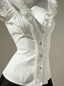 Close-up detail of white slim fit blouse with elegant ruffle trim and puff sleeves