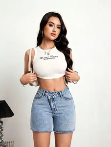 Fashionable women's denim shorts with unique criss-cross waist design and raw hem.