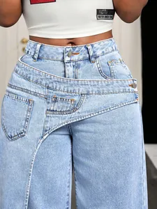 Detailed view of women's high-waisted light blue jeans with asymmetrical crossover waist