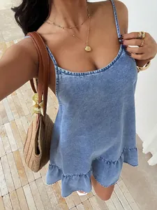 Close-up of casual light blue denim summer dress with ruffled hem and straps