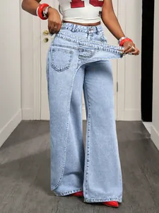 Close-up of wide-leg denim jeans with unique asymmetric overlapping waist design