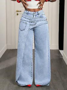 Detailed view of women's light blue wide-leg jeans with unique asymmetric waist design
