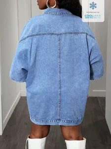 Detailed back view of an oversized sleeveless denim shawl jacket in a light blue wash
