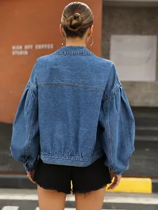 Rear view of a stylish blue loose-fit cropped denim jacket featuring lantern sleeves