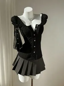 Detailed view of a black slim fit puff sleeve blouse featuring ruffle edges and buttons