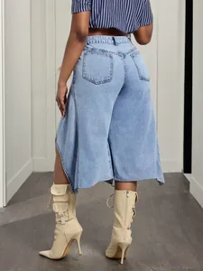 Rear view of women's light wash denim culottes with trendy asymmetrical wide leg hemline