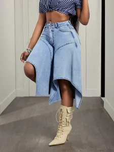 Detail shot of light wash denim skirt-shorts with unique asymmetrical draped design