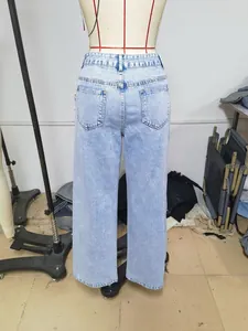 Women's light blue high-waisted wide-leg denim jeans back view with pocket details